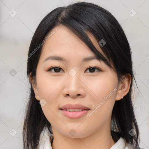 Joyful asian young-adult female with medium  black hair and brown eyes