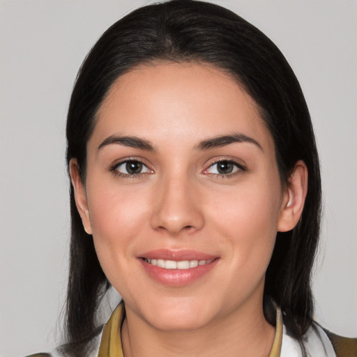 Joyful white young-adult female with medium  black hair and brown eyes