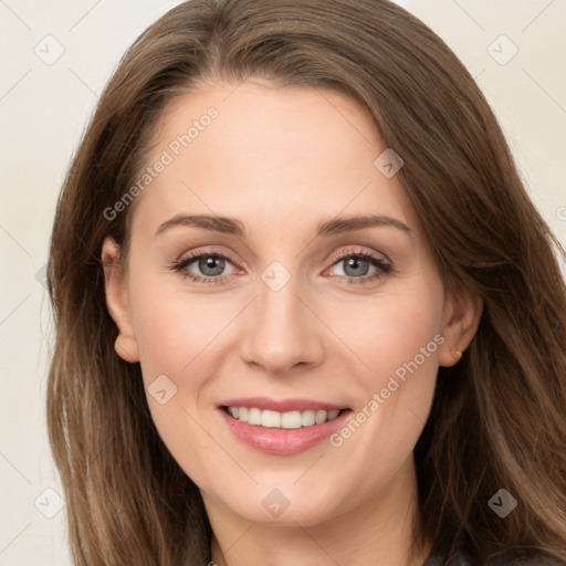 Joyful white young-adult female with long  brown hair and green eyes