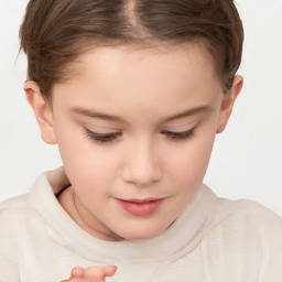 Joyful white child female with short  brown hair and brown eyes