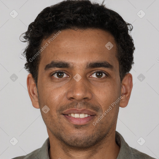 Joyful black young-adult male with short  brown hair and brown eyes