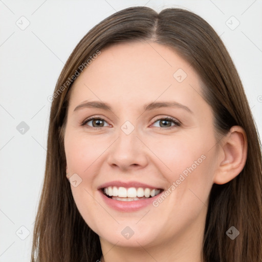 Joyful white young-adult female with long  brown hair and grey eyes