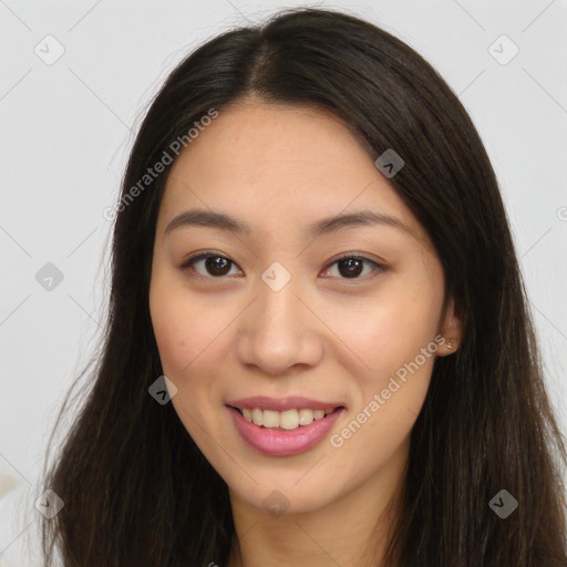 Joyful asian young-adult female with long  brown hair and brown eyes