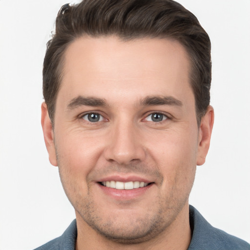 Joyful white young-adult male with short  brown hair and brown eyes