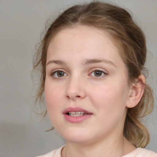 Joyful white young-adult female with medium  brown hair and blue eyes