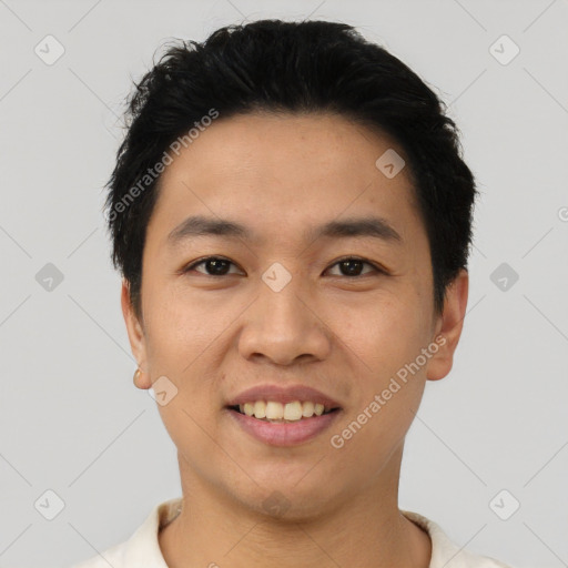 Joyful asian young-adult male with short  black hair and brown eyes