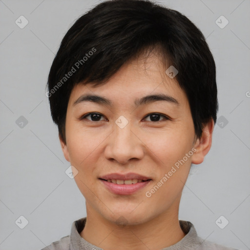 Joyful asian young-adult female with short  black hair and brown eyes