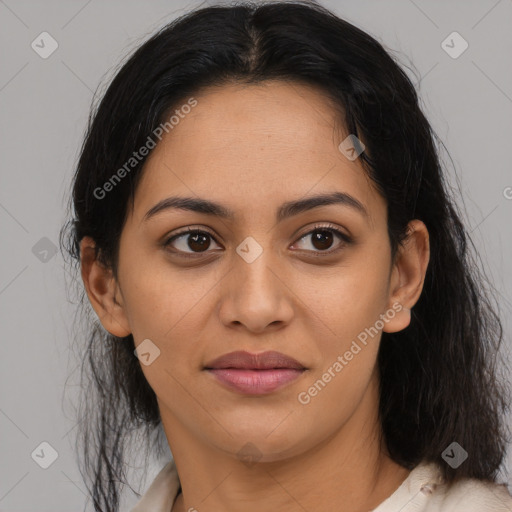 Joyful latino young-adult female with medium  brown hair and brown eyes