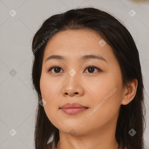 Joyful asian young-adult female with long  brown hair and brown eyes