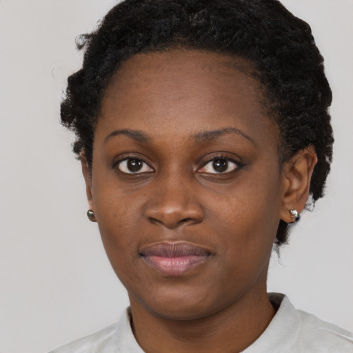 Neutral black young-adult female with short  brown hair and brown eyes