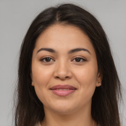 Joyful asian young-adult female with long  brown hair and brown eyes