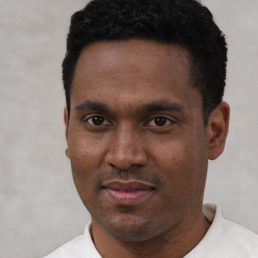 Neutral black young-adult male with short  black hair and brown eyes