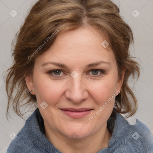 Joyful white adult female with medium  brown hair and blue eyes