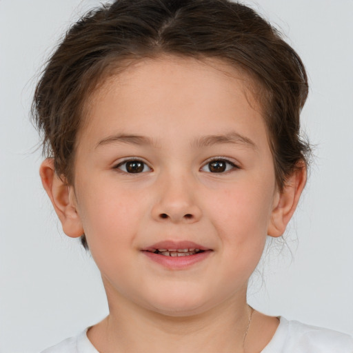 Joyful white child female with short  brown hair and brown eyes