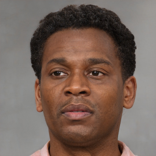 Neutral black young-adult male with short  brown hair and brown eyes
