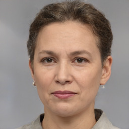 Joyful white adult female with short  brown hair and grey eyes