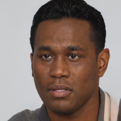Neutral black young-adult male with short  black hair and brown eyes