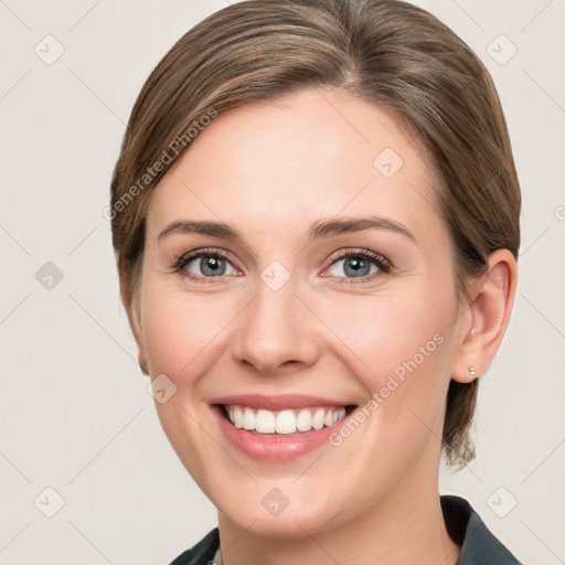 Joyful white young-adult female with medium  brown hair and grey eyes