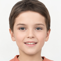 Joyful white child female with short  brown hair and brown eyes