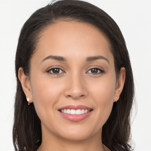 Joyful white young-adult female with long  brown hair and brown eyes