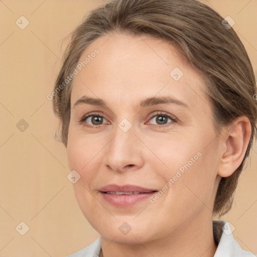 Joyful white adult female with medium  brown hair and brown eyes