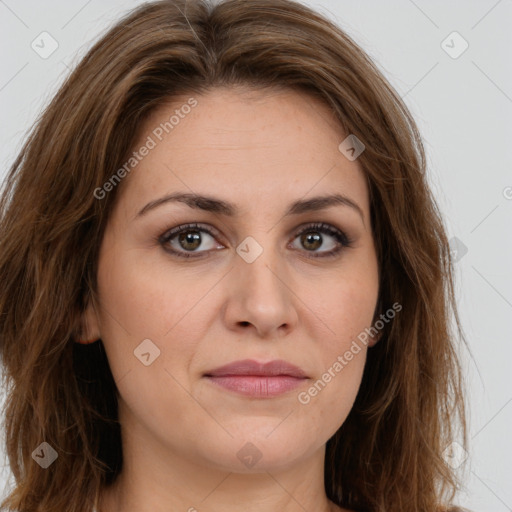 Joyful white young-adult female with long  brown hair and green eyes