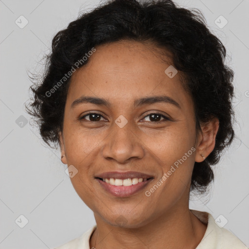 Joyful latino adult female with short  brown hair and brown eyes