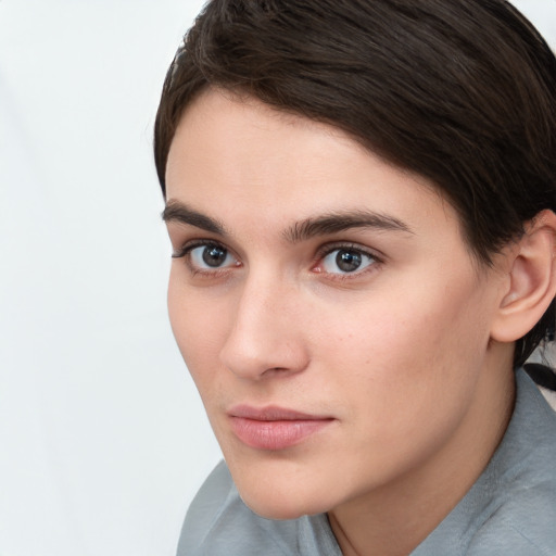 Neutral white young-adult female with short  brown hair and brown eyes