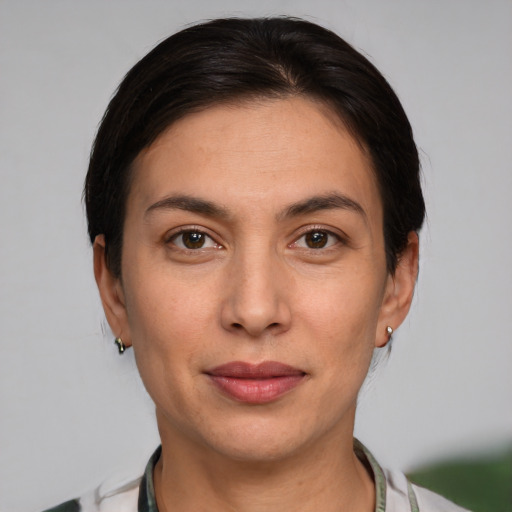 Joyful white young-adult female with short  brown hair and brown eyes