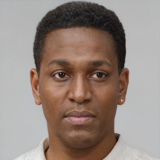 Neutral black young-adult male with short  brown hair and brown eyes