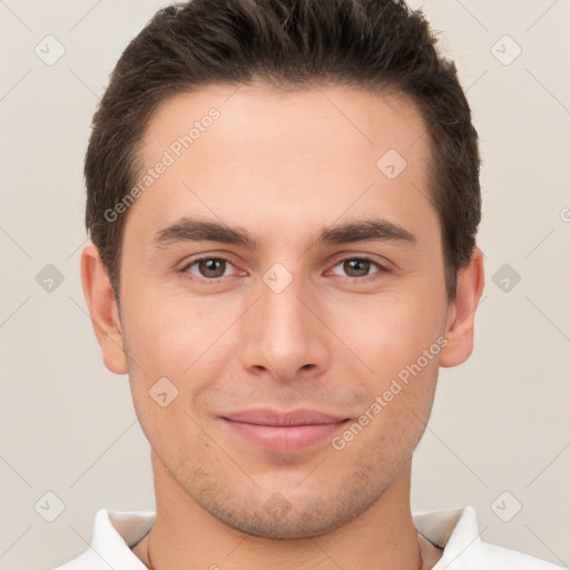 Joyful white young-adult male with short  brown hair and brown eyes