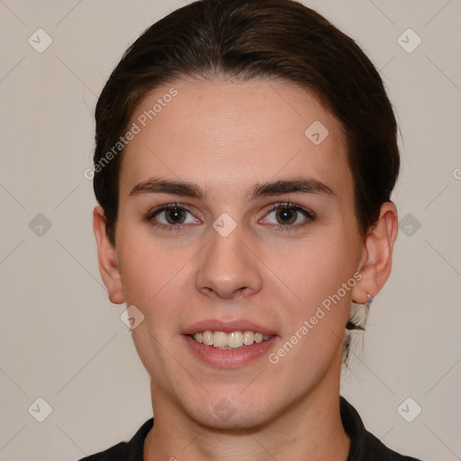 Joyful white young-adult female with short  brown hair and brown eyes