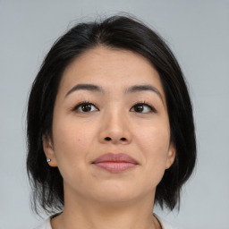 Neutral asian young-adult female with medium  brown hair and brown eyes