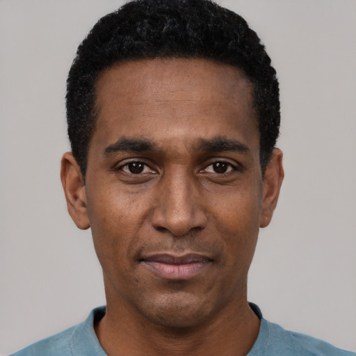 Neutral black adult male with short  black hair and brown eyes