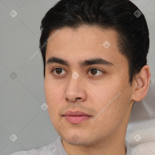 Joyful latino young-adult male with short  brown hair and brown eyes