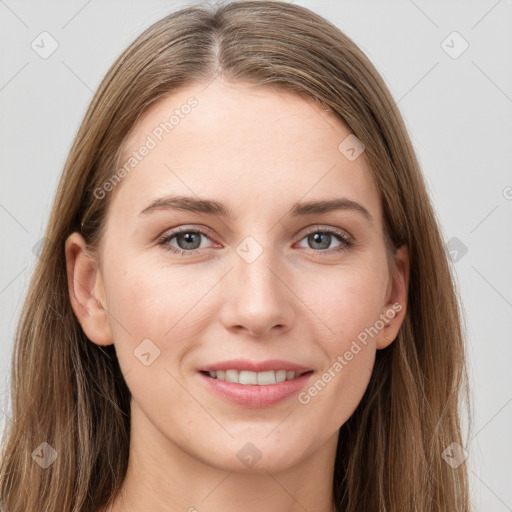 Joyful white young-adult female with long  brown hair and grey eyes