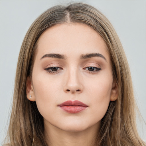 Neutral white young-adult female with long  brown hair and brown eyes