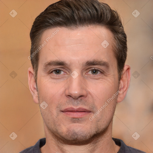 Joyful white adult male with short  brown hair and brown eyes