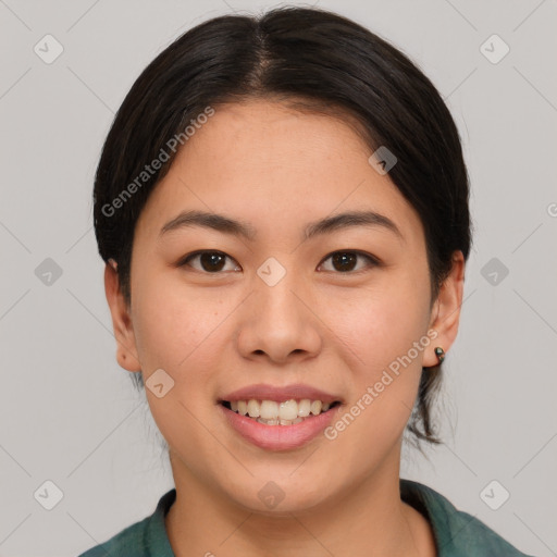 Joyful asian young-adult female with medium  brown hair and brown eyes