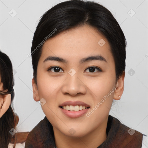 Joyful asian young-adult female with medium  black hair and brown eyes