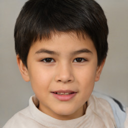 Joyful white child male with short  brown hair and brown eyes