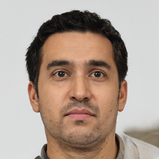 Neutral white young-adult male with short  black hair and brown eyes