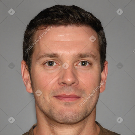 Joyful white adult male with short  brown hair and grey eyes