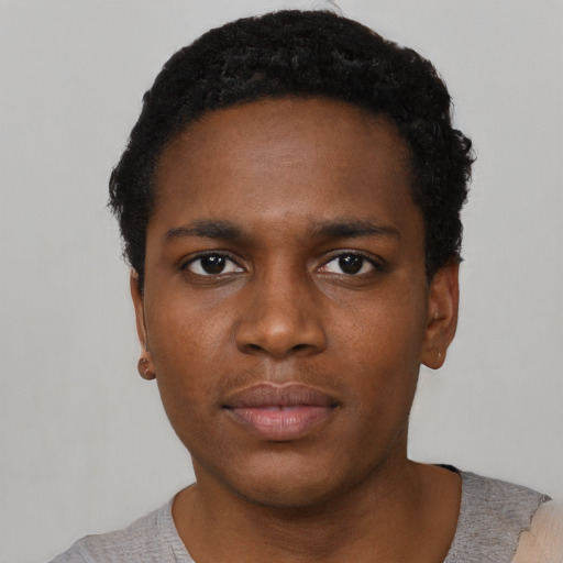 Neutral black young-adult male with short  black hair and brown eyes