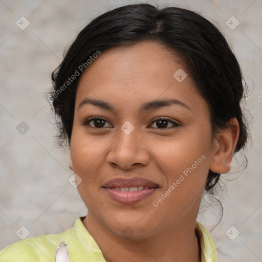 Joyful latino young-adult female with medium  brown hair and brown eyes