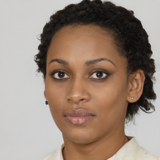 Neutral black young-adult female with short  black hair and brown eyes
