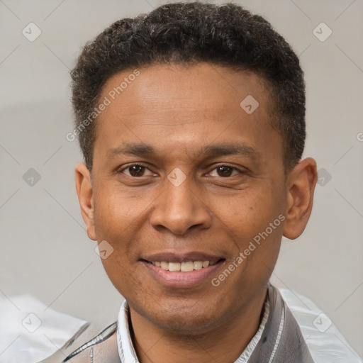 Joyful latino adult male with short  brown hair and brown eyes