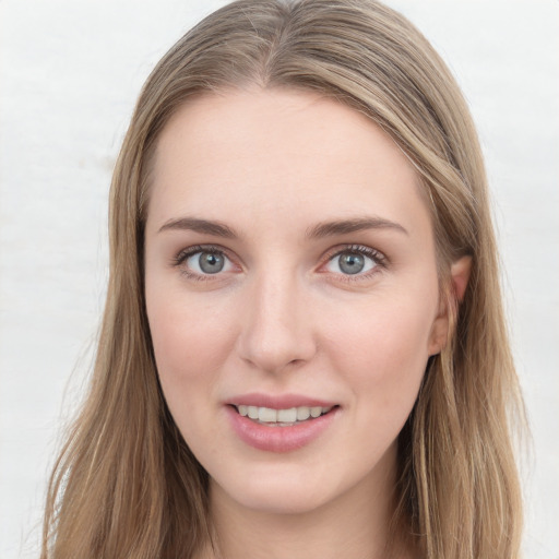 Joyful white young-adult female with long  brown hair and grey eyes