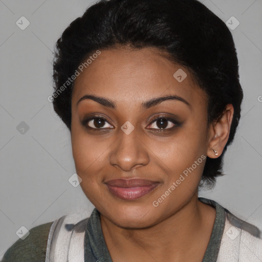 Joyful black young-adult female with short  black hair and brown eyes