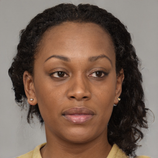 Neutral black adult female with medium  brown hair and brown eyes